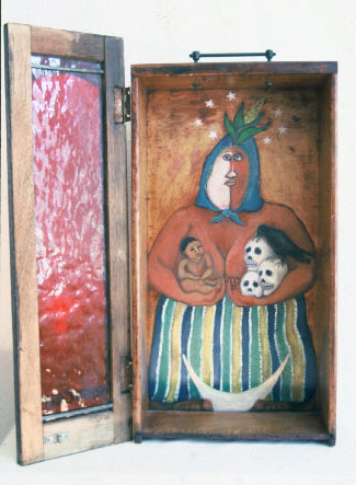 Lammas Goddess, 1995, Oil on wood desk drawer with hinged “door”
22” h x 19” w x 5” deep, Eleanor Ruckman

Lammas is a celebration of the harvest, so this Goddess is crowned with an ear of corn.  She embraces the cycle of life and death.  The white half of her face was originally a white-out stain. 